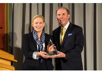 Senator Kirsten Gillibrand and APTS President and CEO Pat Butler posing with award