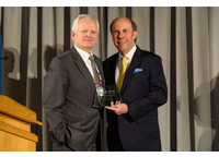 Lloyd Wright, President and CEO of WFYI Public Media and Pat Butler, President and CEO of APTS, pose with award