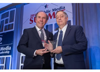 Mark Richer, President of ATSC and Pat Butler, President and CEO of APTS, pose with award