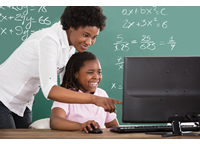 Teacher and student in front of computer